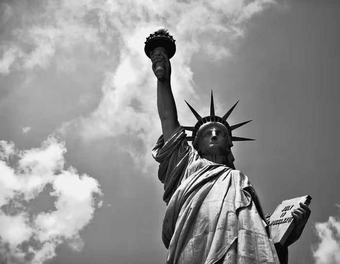 The Statue of Liberty with Lower Manhattan behind it.